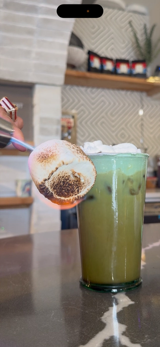 Iced matcha latte with a torched marshmallow